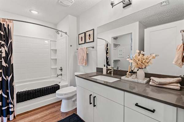 bathroom with a sink, toilet and bathtub at The Revival, Salt Lake City